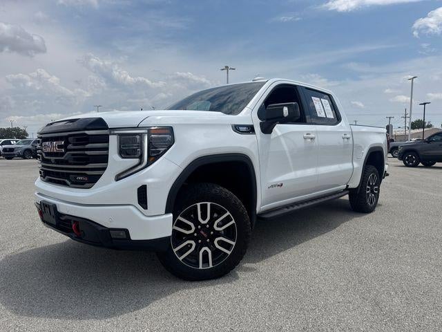 2025 GMC Sierra 1500 Crew Cab Short Box 4-Wheel Drive AT4 in Summit White — front three-quarter view