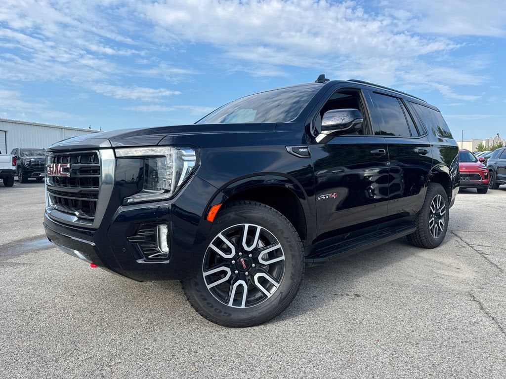 2024 GMC Yukon AT4 in Midnight Blue Metallic — front three-quarter view