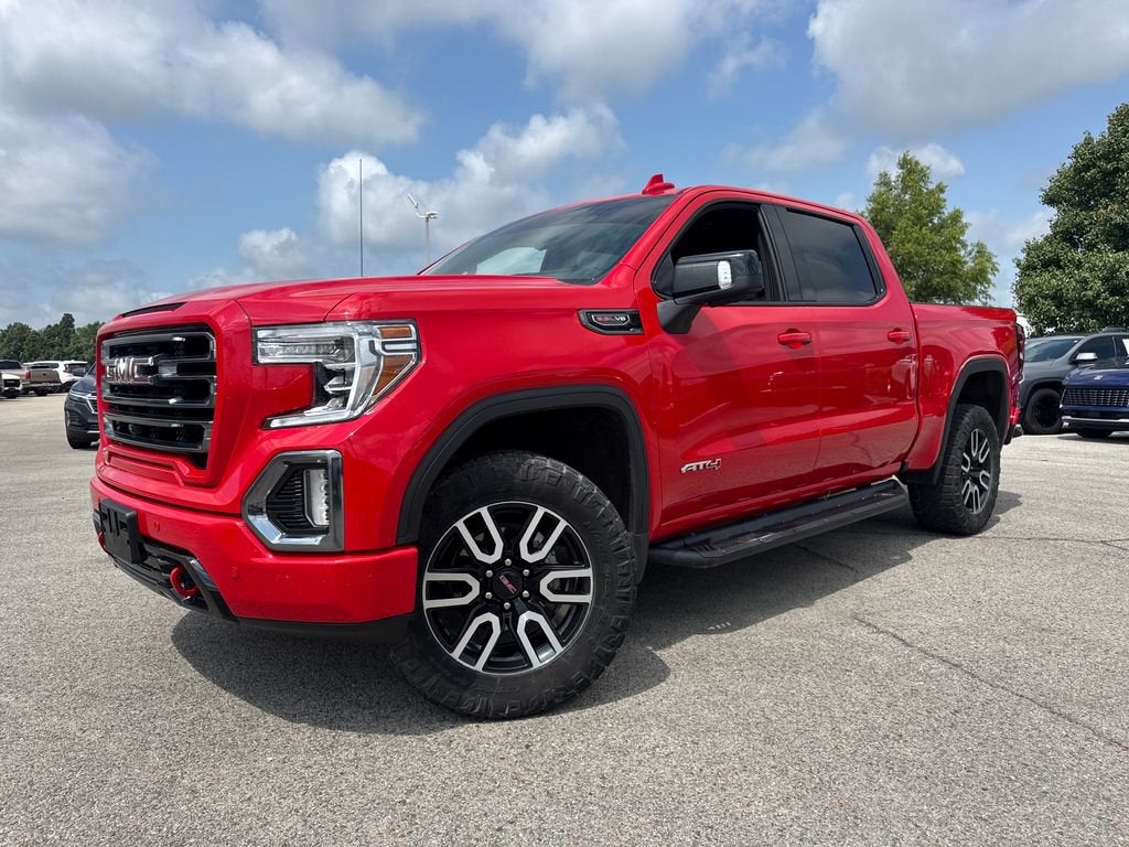 2021 GMC Sierra 1500 AT4 in Cardinal Red — front three-quarter view