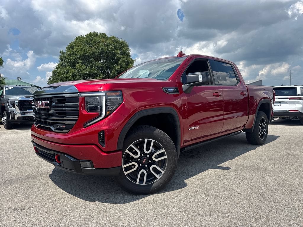 2023 GMC Sierra 1500 AT4 in Volcanic Red Tintcoat — front three-quarter view