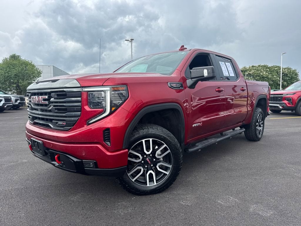 2023 GMC Sierra 1500 AT4 in Volcanic Red Tintcoat — front three-quarter view